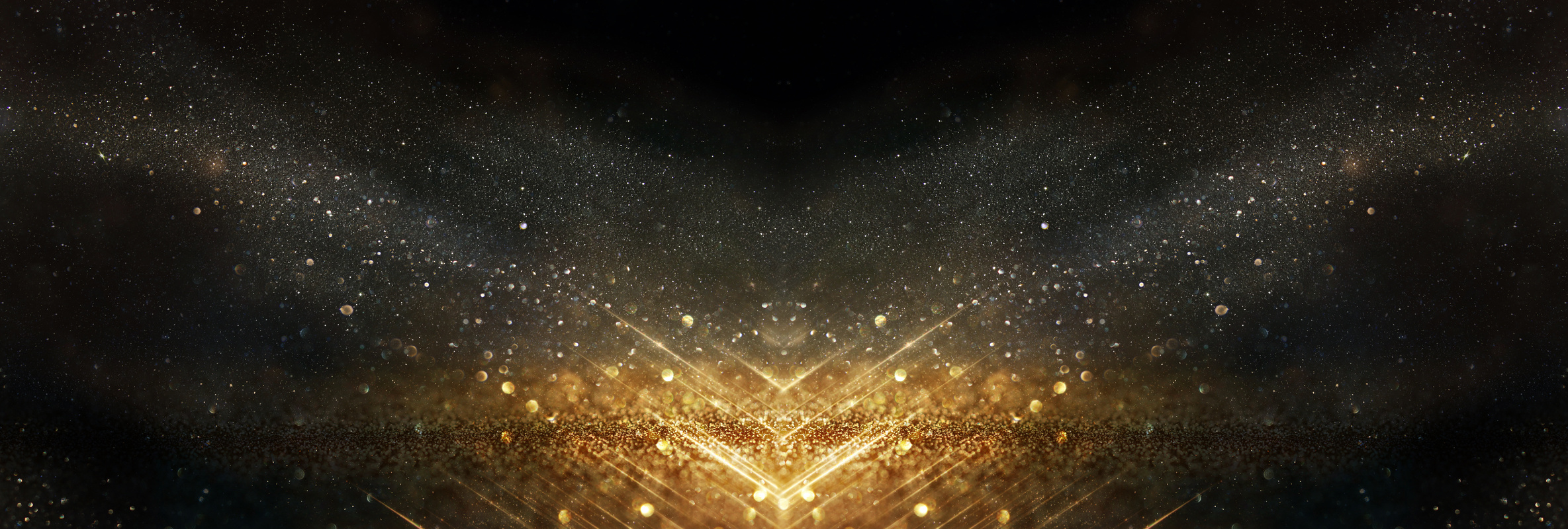 glitter vintage lights background. black and gold. de-focused